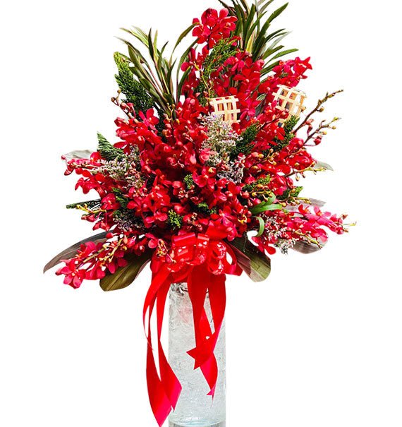 Red Orchids In Vase